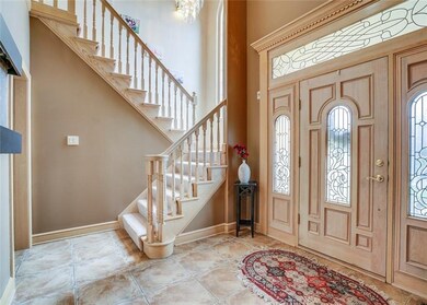 Gorgeous tile entry with glass chandelier, beautif