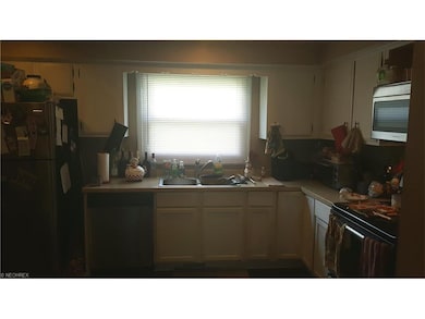 Kitchen with updated cabinets, counter and stainle