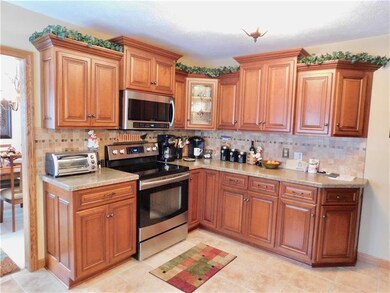 Beautiful Cherry Kitchen with stone backsplash, ce