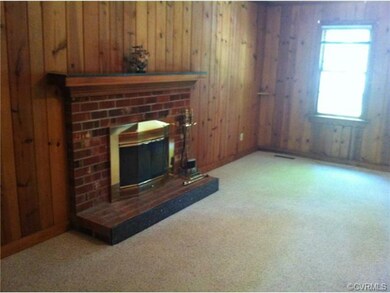 Family room with wood burning fireplace-insert and