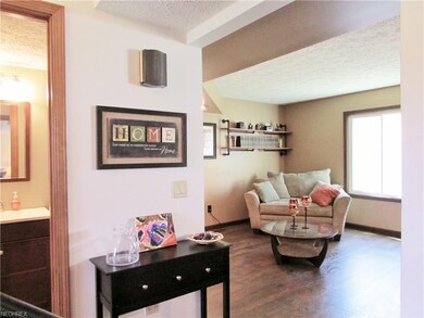 The main floor features a convenient half bath, op