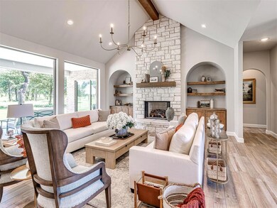 Living room featuring an inviting chandelier, beam