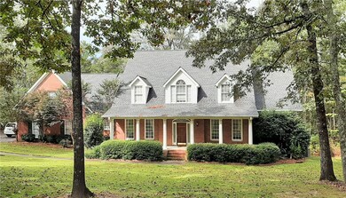 All brick traditional home situated on a three acr