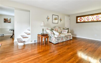 The living room opens to the dining room and famil