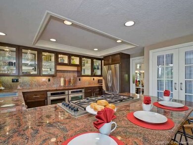 Lots of glass cabinets, stainless steel appliances