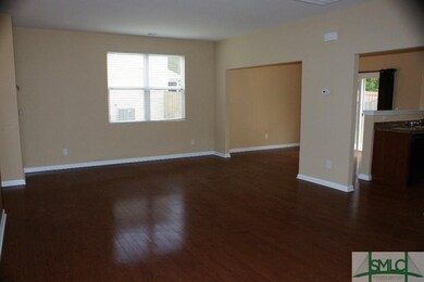 Living Room with entries to Dining and Kitchen
