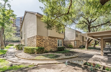 View of side of home featuring brick siding