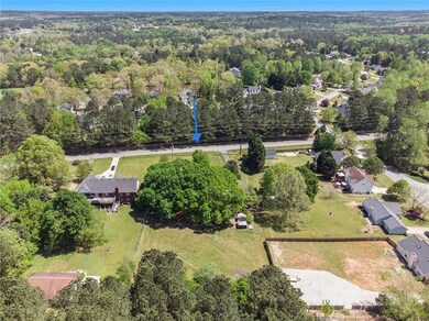 Aerial overview of property's location with a forest