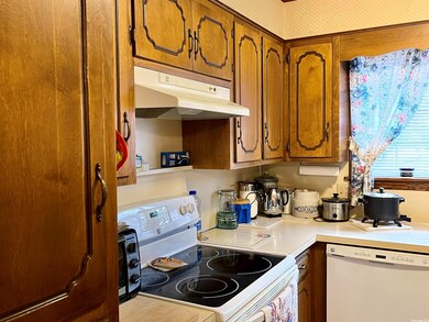 Kitchen has lots of Cabinets, Pantry, Stove & DW