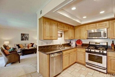 Spacious kitchen located off living room