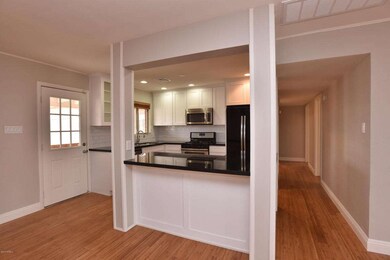 Breakfast Bar Opens to Great-Room
