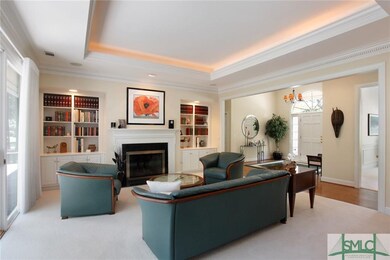 Formal Living Room with fireplace and built-ins. C