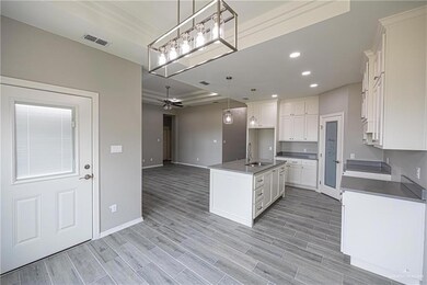 Unfurnished dining area with marble look tile flooring