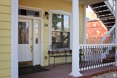 Entrance to property with a wooden deck