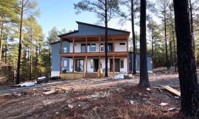 Rear view of house with a balcony