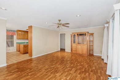 Features include laminate flooring, crown molding,