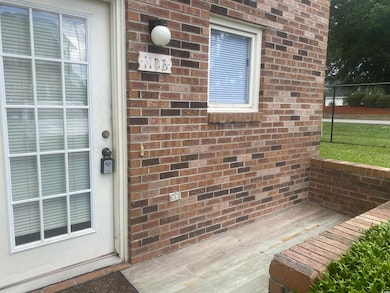 Entrance to property with brick siding