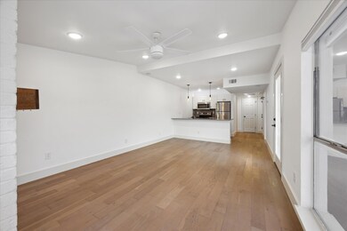 Unfurnished living room with light wood-style flo