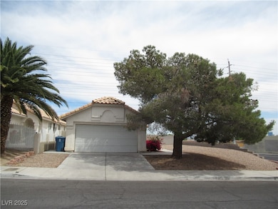View of front of home with a tiled roof, concrete