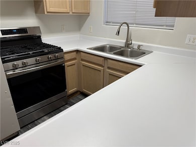 Kitchen with stainless steel range with gas cookto