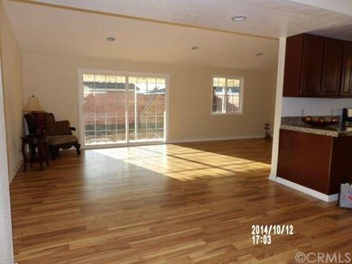 FAMILY ROOM GOING TOWARDS BACK PATIO TROUGH A DOBL