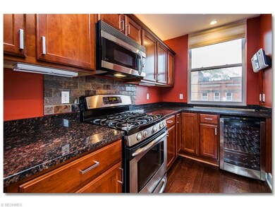 Upgraded Kitchen with Granite Counters, Breakfast Bar, Hardwood Floors and All Stainless Steel               Appliances