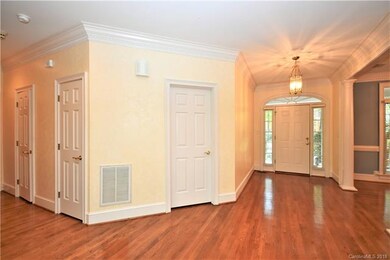 Hardwoods and robust moldings flow from the Foyer 