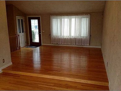 Living Room. OPen floor plan living and dining with beautiful hardwood floors.