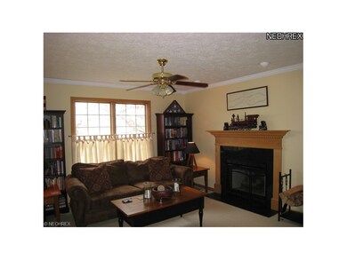 The family room boasts a gas fireplace, ample natu