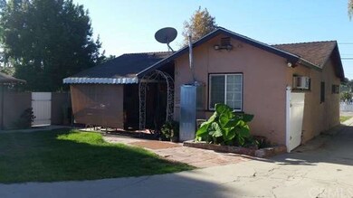 Back of primary residence with shared lawn