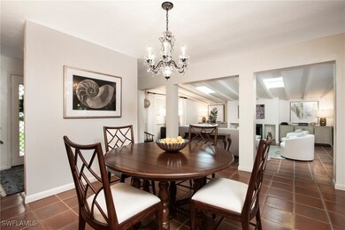 Dining area featuring dark tile patterned floors a