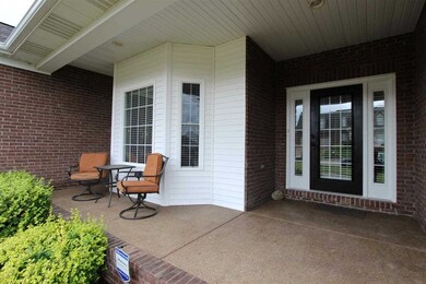 The covered front porch provides a welcoming entra