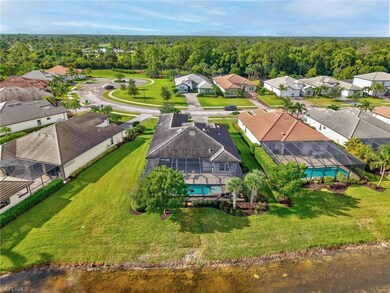 Aerial perspective of suburban area featuring a pool