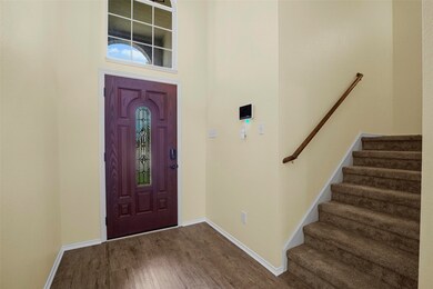 Spacious Entry way leads to stairway