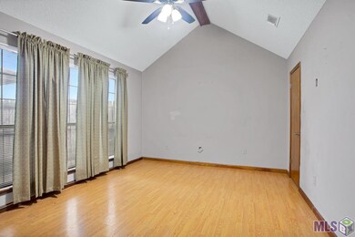 The Master Bedroom is downstairs. High vaulted cei
