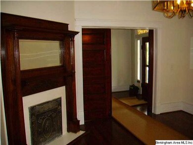 Living Room with Fireplace and Wooden Pocket Doors
