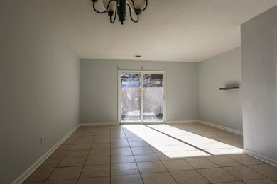 Unfurnished room with an inviting chandelier and l