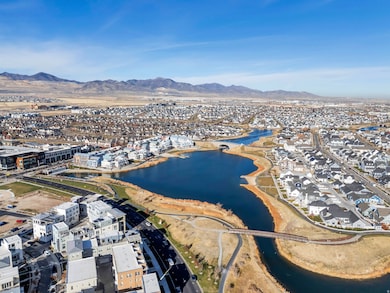 View of property location featuring nearby suburban area and a water and mountain view
