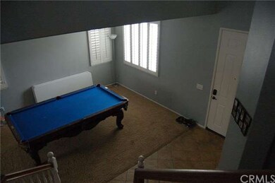 view from stairs down to formal living room