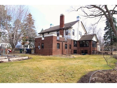 100 foot lot with perennial gardens and sprinkler 