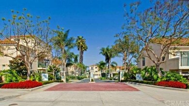 Gated entrance for privacy with lush landscaping. 