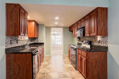 Kitchen with range with electric cooktop, tasteful