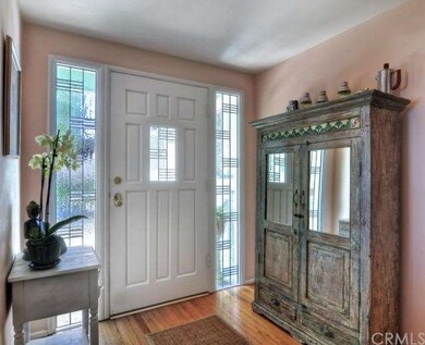 Entry way with beautiful door and side lights.