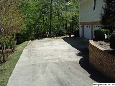 Driveway leading to 2 car garage and basement entr
