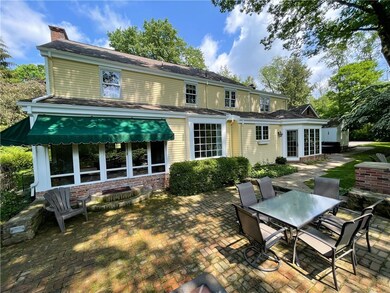 Enjoy the tranquil screened-in porch with shade pr