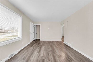 Spare room featuring light wood-type flooring