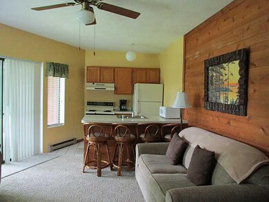 Great Room. To the left is a glass slider that lea