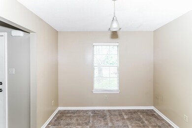 Unfurnished dining area with baseboards