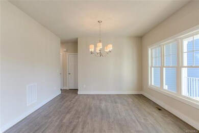 Dining Room/Flex Space has Wood Laminate Floors & 