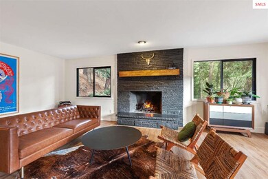 New windows, new trim, wood-burning fireplace is t